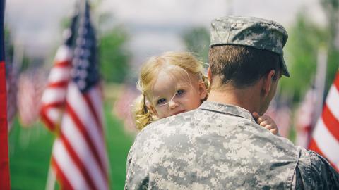 Photo of a veteran and child