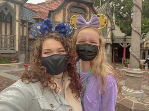 Abigail Cooper and Ashlyn Durfee pose with their Mickey ears in Disneyland