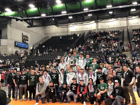 PHS boys wrestling team posing with their 2nd place trophy