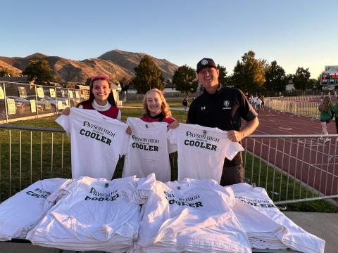 Bre Jardine, Lily Binks and Principal Sorenson passing out "Coolest School" shirts