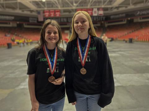 Science Olympiad students pose with their medals from State Competition