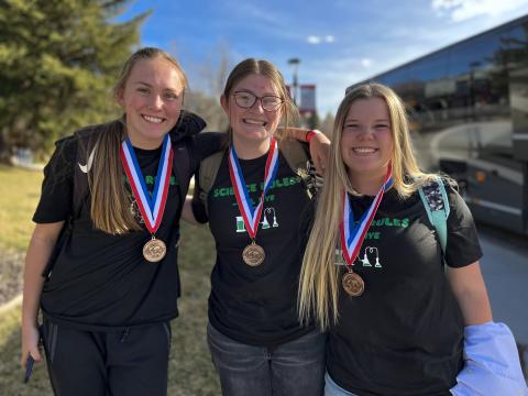 Science Olympiad students pose with their medals from State Competition