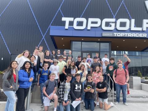 Business and Physics students pose in front of Top Golf in Vineyard. 