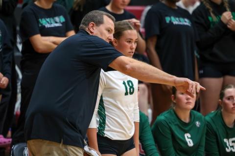 coach giving feedback to volleyball player