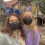 Abigail Cooper and Ashlyn Durfee pose with their Mickey ears in Disneyland