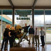 Kevin poses on our Lion statue with PHS administration