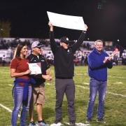 Principal Jesse Sorenson accepts $1,000 check from Western Heating and Air