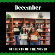 December students of the month pose with their certificates